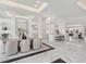 Open concept dining room with marble floors, view into living room at 3582 Recurve Cir, Sarasota, FL 34240