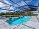 Screened pool and lanai with lake view, paver deck, and water features at 3582 Recurve Cir, Sarasota, FL 34240