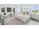 Spacious main bedroom with a large bed, sitting area, and ample natural light at 3582 Recurve Cir, Sarasota, FL 34240