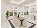 Elegant dining room with marble floors and large windows at 3582 Recurve Cir, Sarasota, FL 34240
