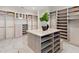 Large walk-in closet with center island and shelving at 3582 Recurve Cir, Sarasota, FL 34240