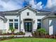 White two-story house with dark roof and landscaping at 3582 Recurve Cir, Sarasota, FL 34240