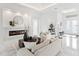 Living room with fireplace, light colored furniture, and marble floors at 3582 Recurve Cir, Sarasota, FL 34240
