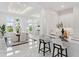 Elegant dining room with marble floors and large windows offering scenic views at 3582 Recurve Cir, Sarasota, FL 34240
