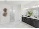 Elegant bathroom with double vanity, marble flooring, and a walk-in shower at 3582 Recurve Cir, Sarasota, FL 34240