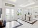 Elegant dining room with marble floors and large windows at 3582 Recurve Cir, Sarasota, FL 34240