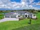 Stunning curb appeal! This home features a three-car garage and beautifully landscaped grounds at 3582 Recurve Cir, Sarasota, FL 34240