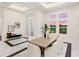 Elegant dining room with marble floors and large windows at 3582 Recurve Cir, Sarasota, FL 34240