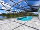 Resort-style pool with a covered patio and a lake view at 3582 Recurve Cir, Sarasota, FL 34240
