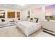 Spacious main bedroom with a large bed, sitting area, and ample natural light at 3582 Recurve Cir, Sarasota, FL 34240
