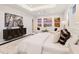 Spacious main bedroom with a large bed, sitting area, and ample natural light at 3582 Recurve Cir, Sarasota, FL 34240