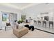 Open concept living area with views into the kitchen and backyard at 3582 Recurve Cir, Sarasota, FL 34240