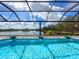 Relaxing pool with lake view and decorative fountains at 3582 Recurve Cir, Sarasota, FL 34240