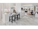 Modern kitchen island with marble countertops and sleek barstools at 3582 Recurve Cir, Sarasota, FL 34240
