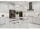 Modern kitchen with white cabinets, stainless steel appliances, and a large island at 3582 Recurve Cir, Sarasota, FL 34240