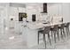 Spacious kitchen with white cabinets, marble countertops and breakfast bar at 3582 Recurve Cir, Sarasota, FL 34240