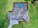 Overhead view of a home showcasing a large backyard, pool, and paved driveway at 3582 Recurve Cir, Sarasota, FL 34240