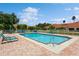 Inviting community pool with lounge chairs at 5635 Spanish Point Ct, Palmetto, FL 34221