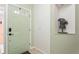Light and airy entryway with a pale green door at 5635 Spanish Point Ct, Palmetto, FL 34221