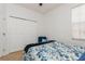 Bedroom with a queen-size bed, large closet, and blue accents at 5635 Spanish Point Ct, Palmetto, FL 34221
