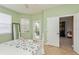 Bedroom with sliding glass door to patio access, and walk-in closet at 5635 Spanish Point Ct, Palmetto, FL 34221