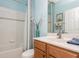 Small bathroom with shower/tub combo and wood vanity at 5635 Spanish Point Ct, Palmetto, FL 34221