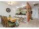 Farmhouse dining table with seating for six in a bright dining area at 5635 Spanish Point Ct, Palmetto, FL 34221