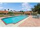 Inviting community pool with lounge chairs at 5635 Spanish Point Ct, Palmetto, FL 34221