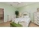 Guest bedroom with a queen-size bed, built-in dresser and en-suite bathroom at 5635 Spanish Point Ct, Palmetto, FL 34221