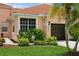 Front view of a house with a one-car garage at 5635 Spanish Point Ct, Palmetto, FL 34221