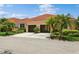 Front view of a two-story house with a two-car garage at 5635 Spanish Point Ct, Palmetto, FL 34221