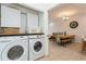 Laundry room with washer, dryer, and additional storage at 5635 Spanish Point Ct, Palmetto, FL 34221