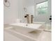 Modern bathroom with a rectangular sink and updated faucet at 107 Elm Ave, Anna Maria, FL 34216