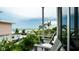 Balcony with ocean view and seating for two at 107 Elm Ave, Anna Maria, FL 34216