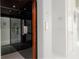 Modern elevator with dark wood and glass accents at 107 Elm Ave, Anna Maria, FL 34216