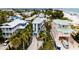 Beachfront property surrounded by lush tropical landscaping at 107 Elm Ave, Anna Maria, FL 34216
