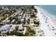 Aerial of beachfront homes and beautiful beach at 107 Elm Ave, Anna Maria, FL 34216