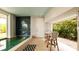 Relaxing pool area with patio furniture and lush greenery at 107 Elm Ave, Anna Maria, FL 34216