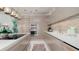Modern kitchen with neutral cabinets, quartz countertops and stainless steel appliances at 107 Elm Ave, Anna Maria, FL 34216