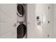 Convenient laundry room with stackable washer and dryer at 107 Elm Ave, Anna Maria, FL 34216