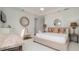Bright bedroom with king-size bed, ocean view, and built-in workspace at 107 Elm Ave, Anna Maria, FL 34216
