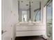 Elegant bathroom with double vanity and ocean view at 107 Elm Ave, Anna Maria, FL 34216