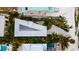 Unique home with metal roof and lush landscaping at 107 Elm Ave, Anna Maria, FL 34216