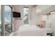 Cozy bedroom with full-size bed and sliding glass door to patio at 107 Elm Ave, Anna Maria, FL 34216