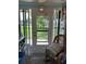Sunroom with view of the community and sliding glass door at 4540 Tippecanoe Trl # 183, Sarasota, FL 34233