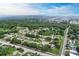 Aerial view of a residential community surrounded by lush greenery and a nearby pond at 1705 Curry Ave # 85, Nokomis, FL 34275