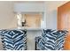 Breakfast bar with zebra print stools, perfect for casual dining and entertaining at 1705 Curry Ave # 85, Nokomis, FL 34275
