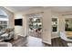 Living room with sliding glass doors opening to the pool and patio at 4300 Timberline Blvd, Venice, FL 34293