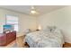 Cozy bedroom with wood-look floors and a comfortable bed at 1705 Curry Ave # 85, Nokomis, FL 34275
