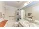 Clean bathroom with bathtub, shower, and vanity at 1705 Curry Ave # 85, Nokomis, FL 34275
